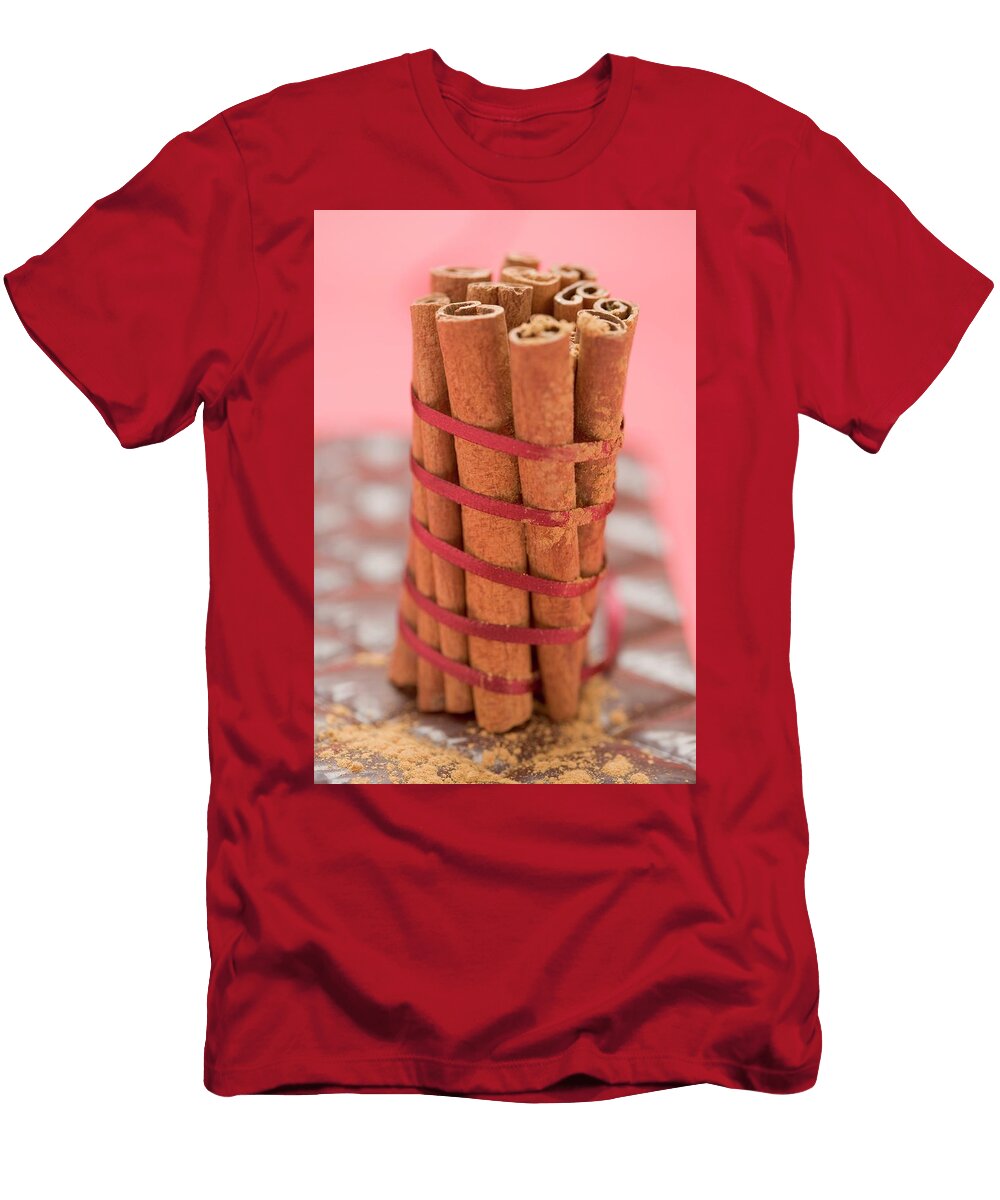 Cinnamon Sticks Tied Together with Red Ribbon on Chocolate Eising Studio Food Photo and Video T-Shirt