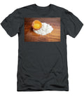 Cracked Egg Shell with a Egg Yolk and a Pile of White Flour on a Dorin Puha T-Shirt
