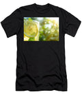 Dew Drops on Lemonade Glass with Sunlit Green Backdrop Michal Bednarek T-Shirt