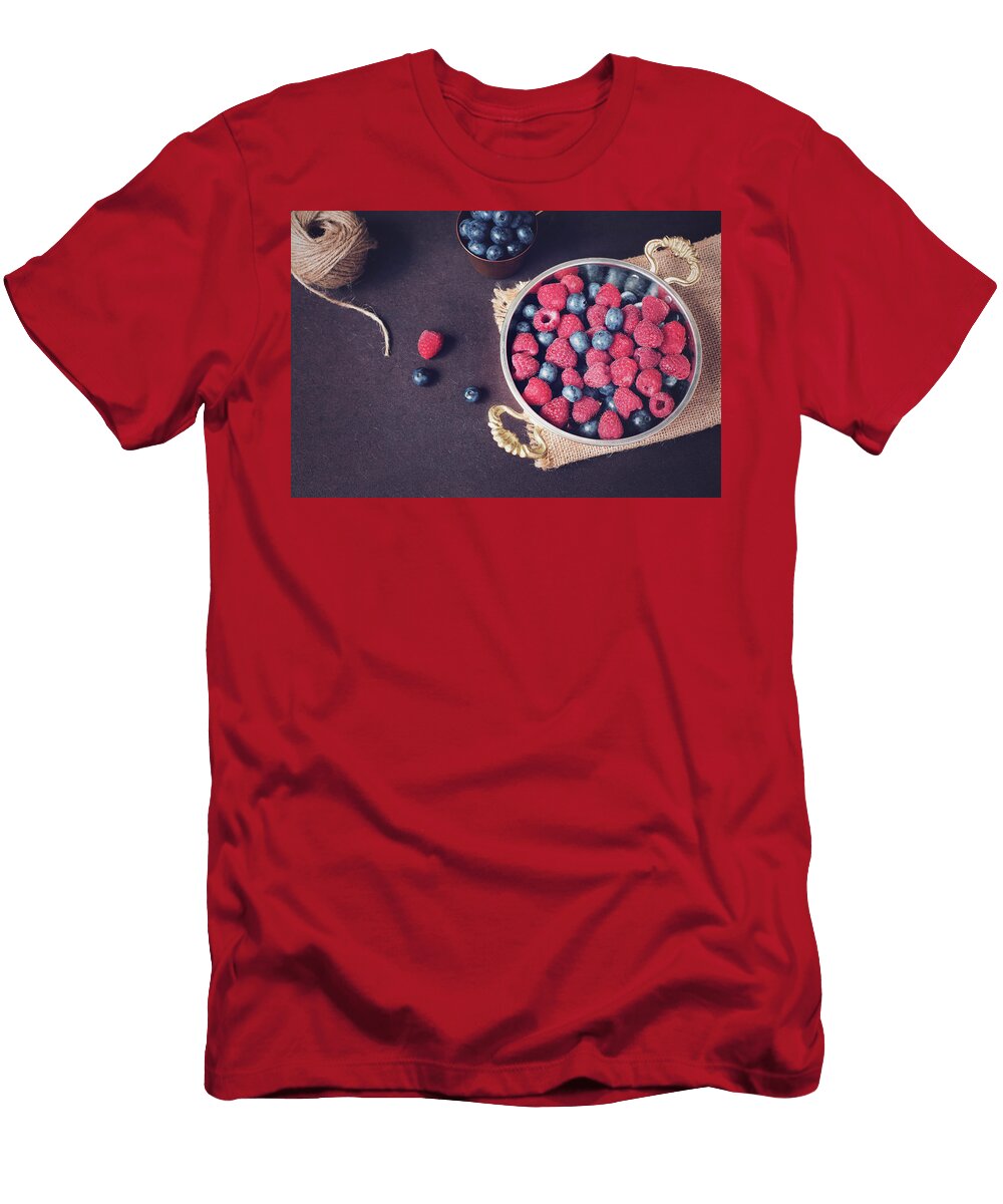 Fresh Raspberries and Blueberries Dark Picture with Copy Space on Left Fresh Fruits Berries in an Old Copper Cup Bowl Dark Styled Stock Photo Black Background Sevda Stancheva T-Shirt