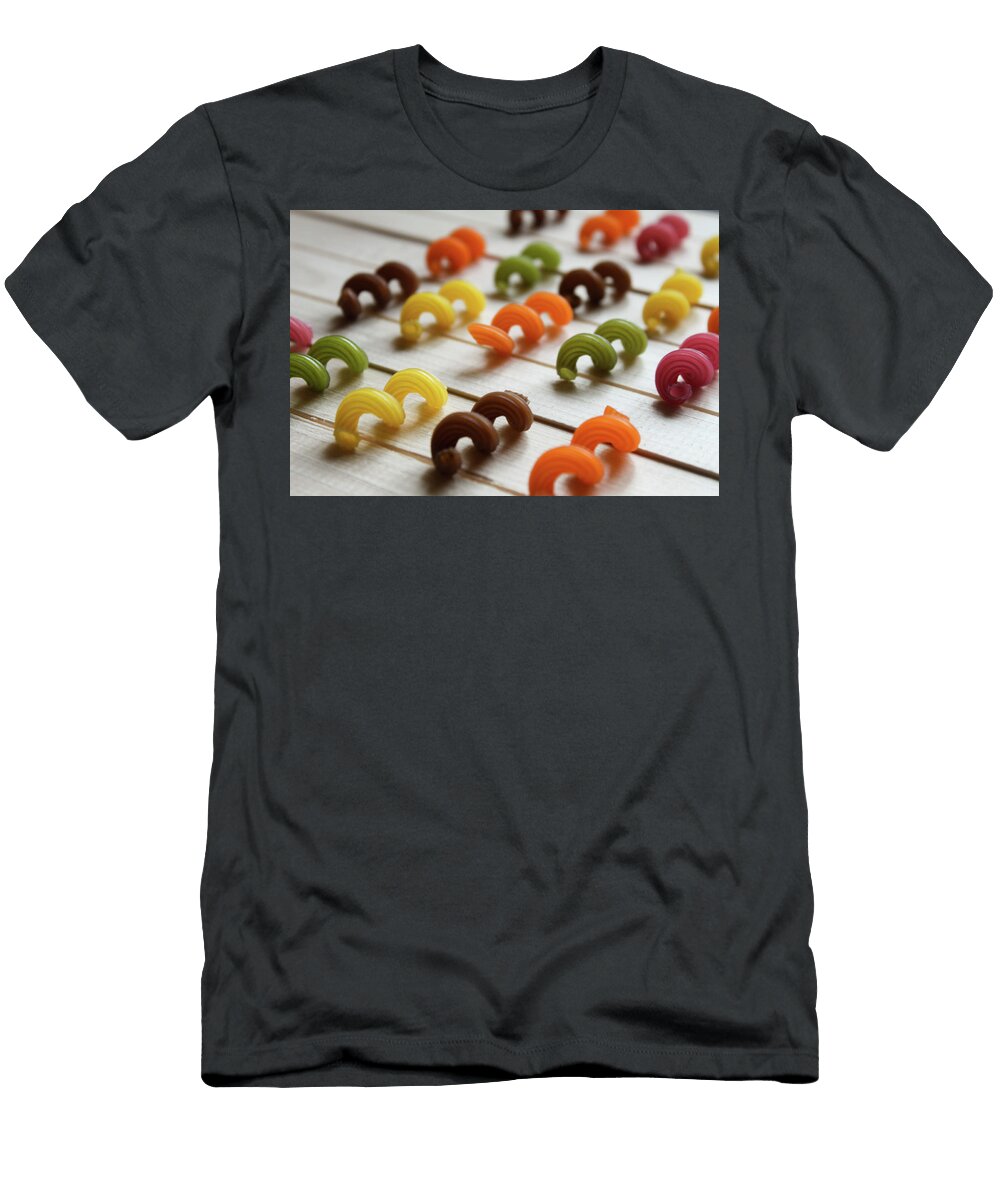 Multicolored Pasta Lying on a Wooden Table Natalia Ochkalo T-Shirt