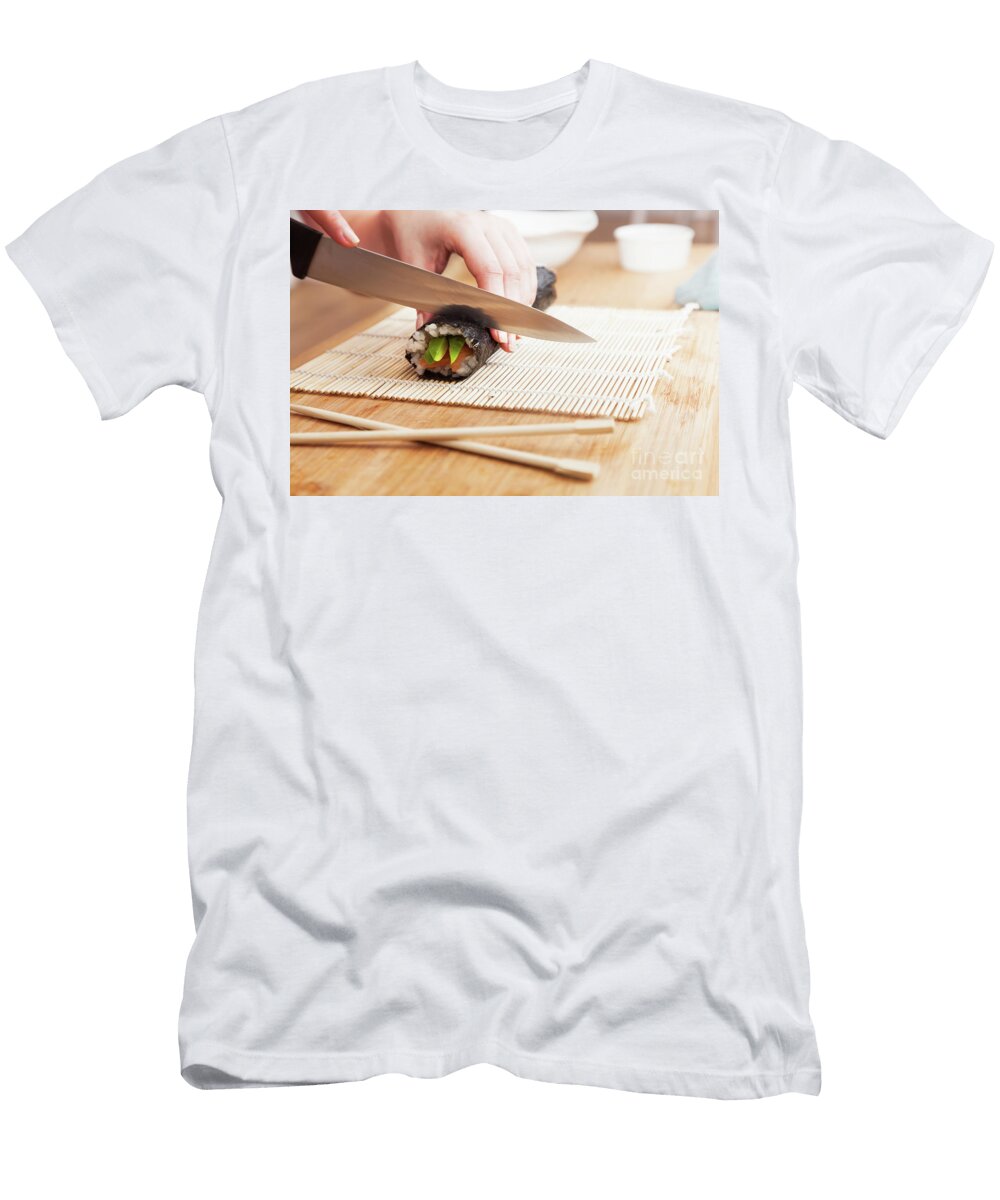 Preparing Sushi Cutting Salmon Avocado Rice and Chopsticks on Wooden Table Michal Bednarek T-Shirt