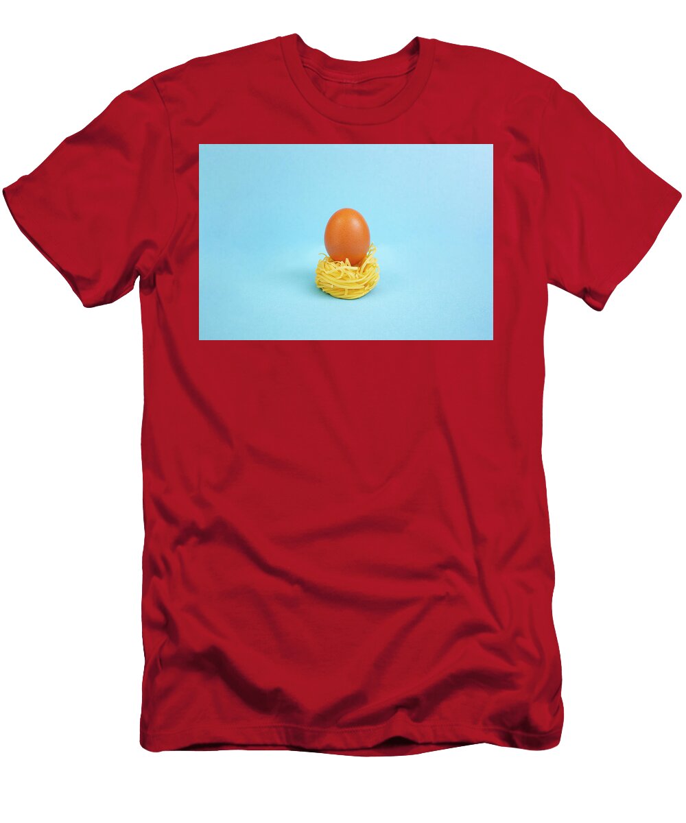 Raw Whole Egg on a Rolled Pasta Nest on Bright Blue Background Dorin Puha T-Shirt