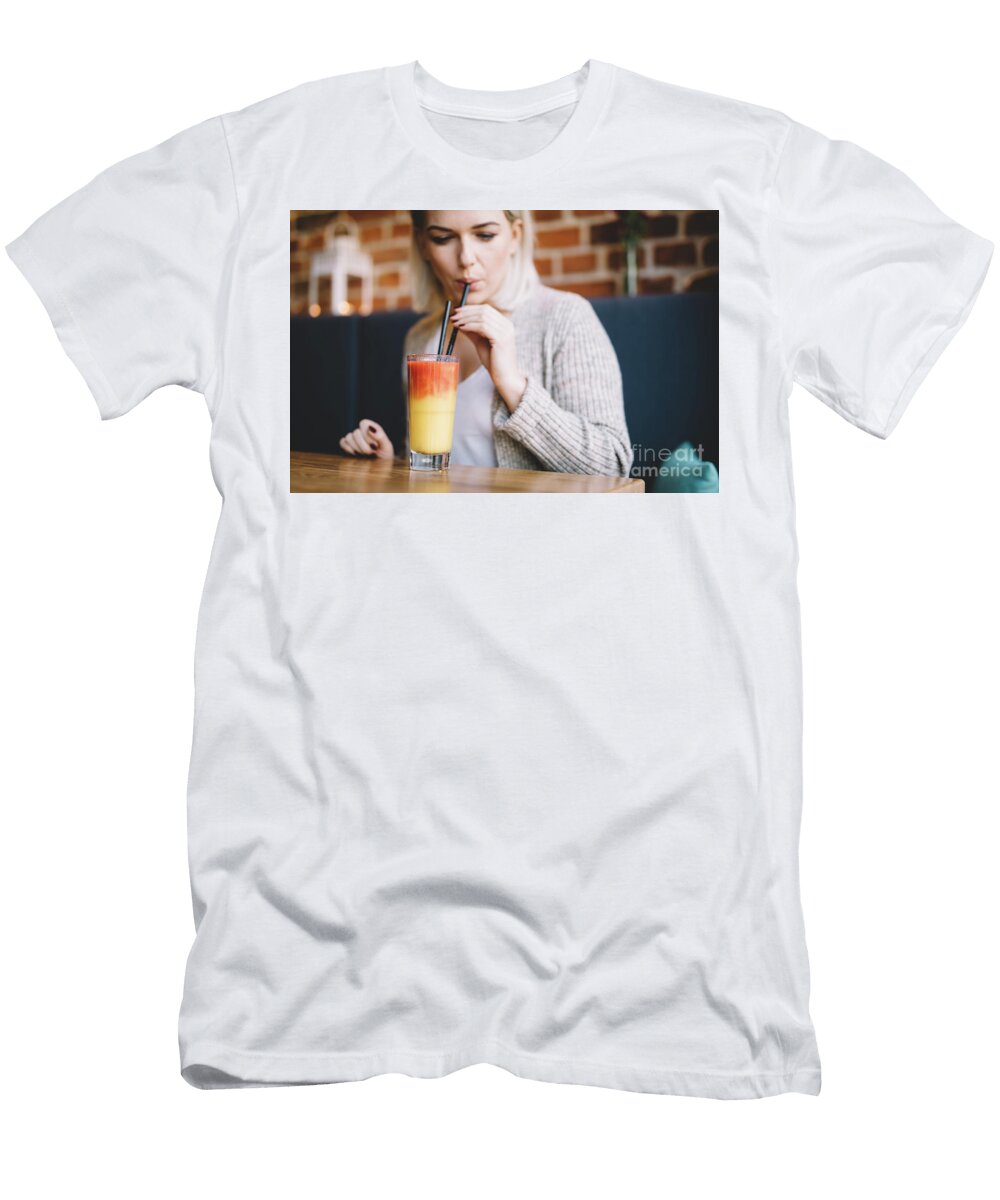Young Woman Sipping a Healthy Smoothie in a Restaurant Michal Bednarek T-Shirt